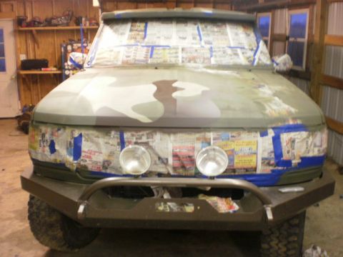 1995 Ford Bronco - This 1995 Ford Bronco is being prepped for a camouflage paint job in a garage.
