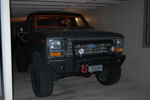 1982 Ford Bronco - This Ford truck, likely from the early 1980s, has a custom bumper and roll cage.