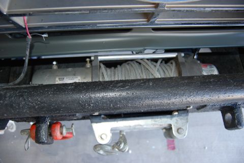 1982 Ford Bronco - Close-up view of a vehicle's front-mounted winch and tow hook assembly.