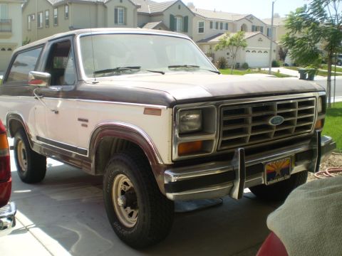 1982 Ford Bronco - This two-tone SUV is a 1982 Ford Bronco, identified by its distinctive body style.