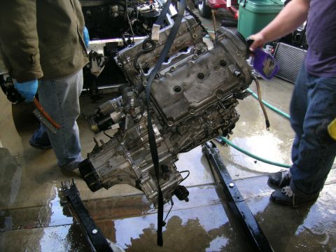 1993 Ford Probe - An engine and transmission assembly is being lifted, with a SuperMotors.net logo visible in the lower right corner.