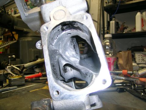 1993 Ford Probe - Close-up of a dirty turbocharger housing, showing internal components and wear.