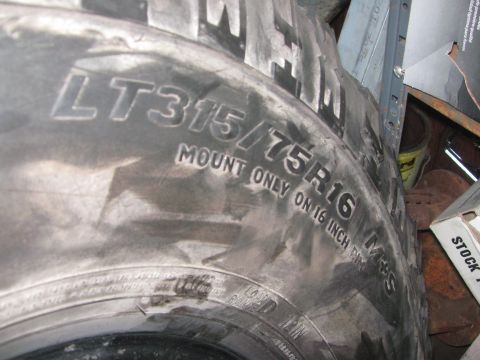 1968 Ford Mustang - Close-up of a tire showing its size and mounting instructions.