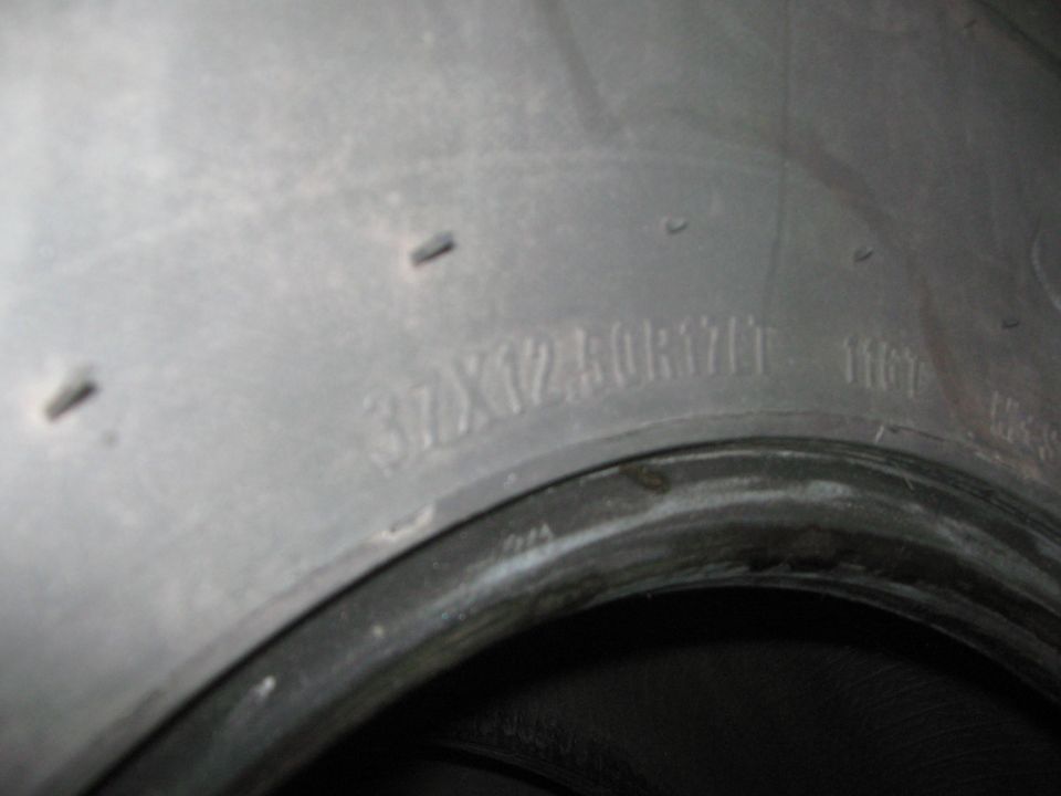 Close-up of tire sidewall showing size 37x12.50R17LT and DOT code 1107