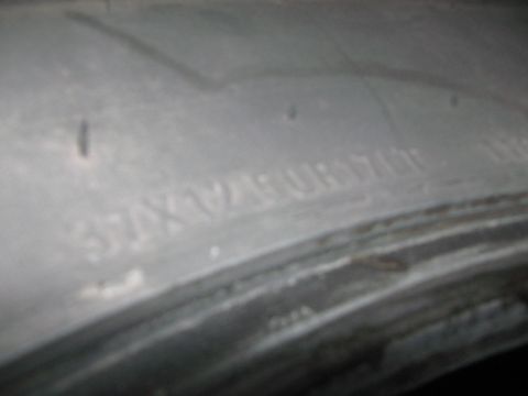 1968 Ford Mustang - Close-up of a tire sidewall showing embossed lettering and markings.
