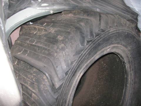 1968 Ford Mustang - A close-up view of a large tractor tire, showing its aggressive tread pattern.