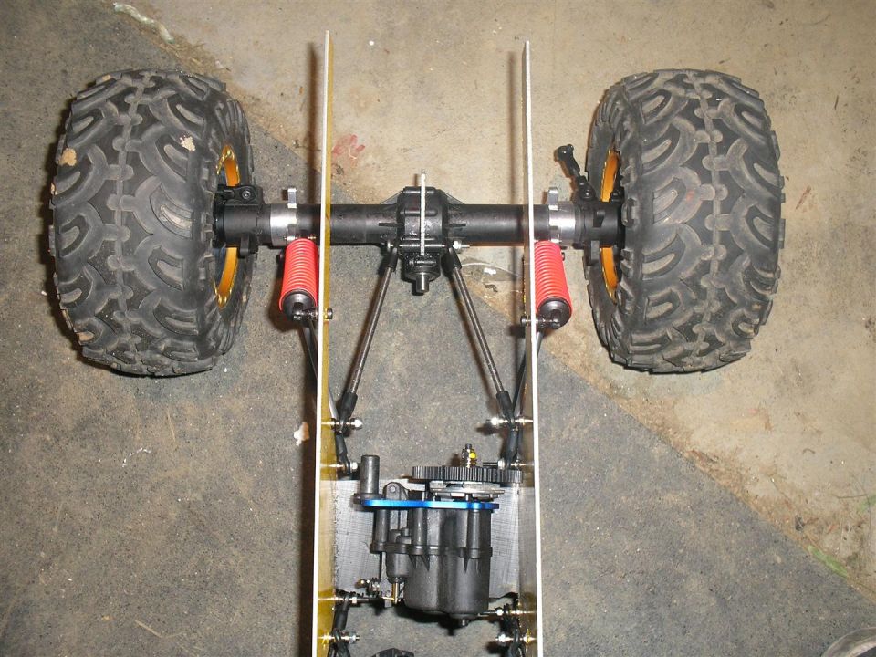 RC car chassis showing rear axle, suspension, and motor assembly