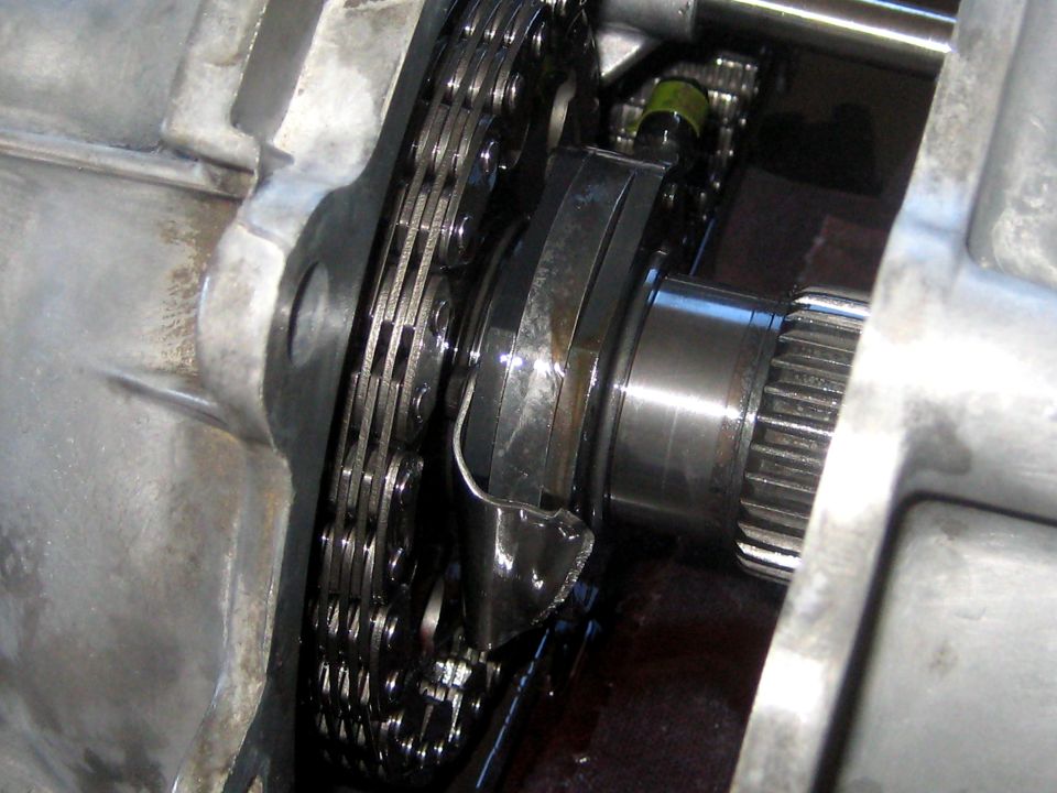 Close-up of a damaged transfer case chain and splined shaft
