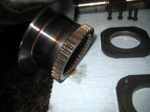 1996 Ford Bronco - Close-up of a metal gear and associated parts, likely from a vehicle's transfer case.