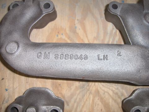1970 Chevrolet Camaro - Close-up of a cast iron exhaust manifold showing the part number GM 8989043 LH 2.
