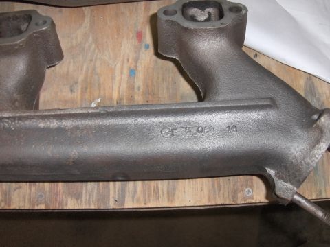 1970 Chevrolet Camaro - Cast iron exhaust manifold with stamped numbers 'CE H 09 10'.