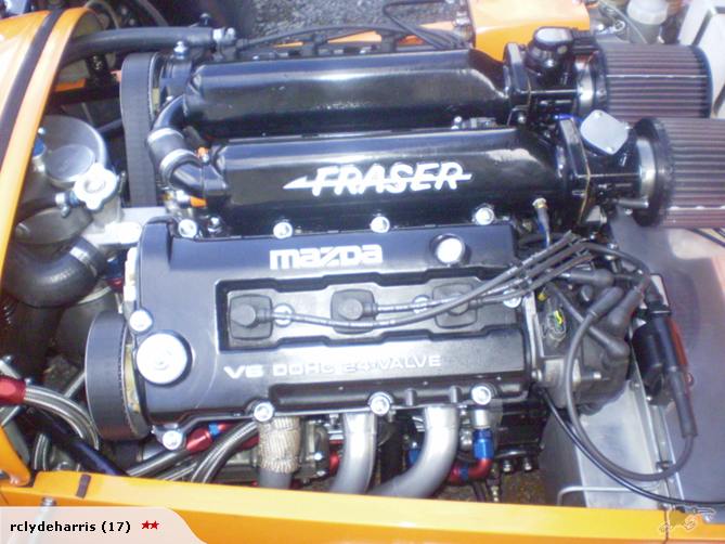 Mazda V6 engine with FRASER branding, dual air filters, and orange bodywork