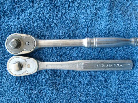1986 Ford Bronco - Two ratchets are displayed on a blue towel. One ratchet has a ribbed handle, while the other is marked 'FORGED IN U.S.A.'