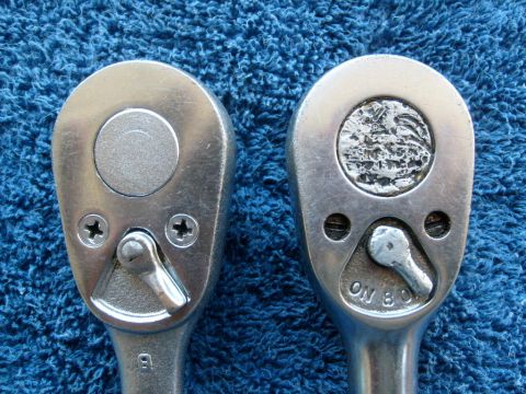 1986 Ford Bronco - Close-up of two ratchet wrenches, one showing a smooth cap and the other a textured cap with "ON 8" visible.