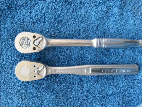 1986 Ford Bronco - Two ratchets are shown on a blue textured surface. One is a Craftsman brand ratchet.