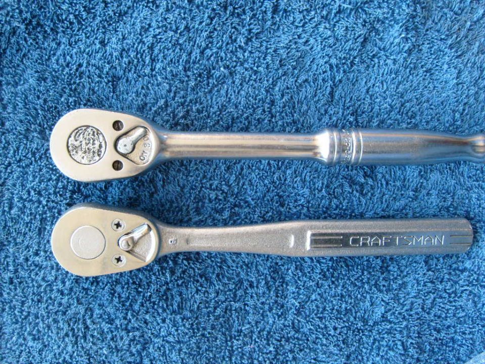 Two ratchets on a blue towel. One has a circular logo on the head, the other says CRAFTSMAN
