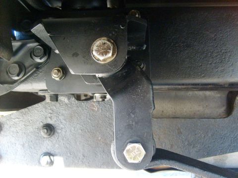 1986 Ford Bronco - Close-up view of a vehicle's undercarriage suspension system.
