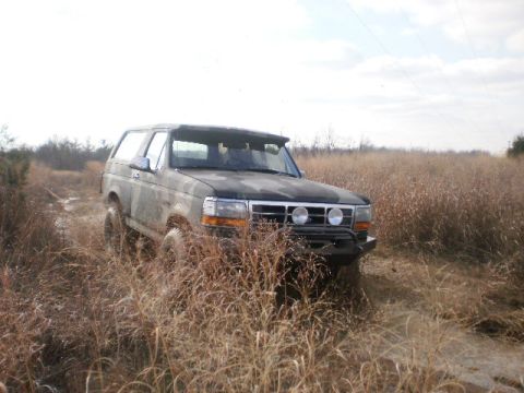 1995 Ford Bronco - This 1995 Ford Bronco is shown off-road in a dry, grassy field.