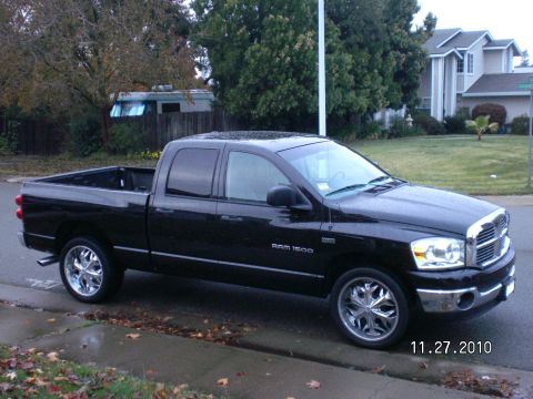 1996 Ford Bronco - This black Dodge Ram 1500 pickup truck is shown from a 3/4 front angle on a street.