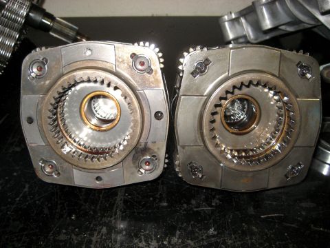 1996 Ford Bronco - Close-up view of two transfer case components, showing internal gears and construction.