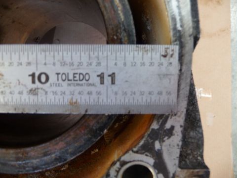 1993 Mazda MX-3 - A Toledo Steel International ruler measures the bore of an engine cylinder, likely for determining liner size.