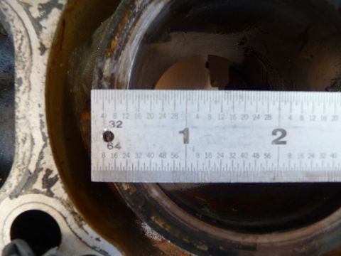1993 Mazda MX-3 - A ruler measures the diameter of an engine cylinder bore, indicating a part rather than a complete vehicle.