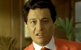 1991 Ford LTD Crown Victoria - A man in a coral suit and patterned tie appears distressed in this scene.