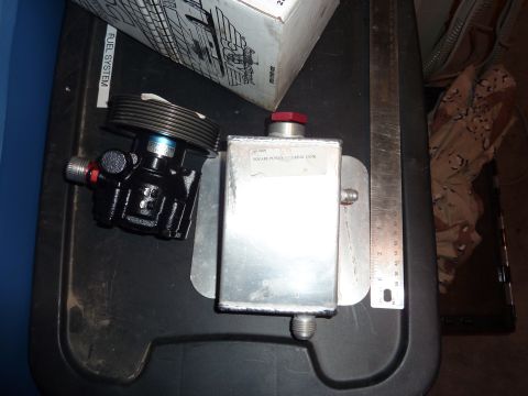 1971 Ford Mustang - Power steering pump and reservoir shown with a ruler for scale.