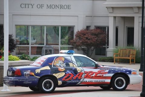 1991 Ford Crown Victoria - This police car features DARE program graphics and cartoon characters, promoting a message against drugs and violence.