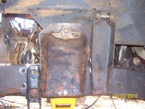 1978 Ford Bronco - This photo shows the underside of a vehicle, focusing on the frame and suspension system, with visible rust and wear.