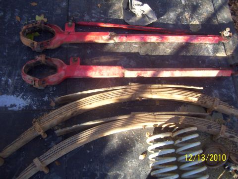 1978 Ford Bronco - Red suspension arms and leaf springs are shown with coil springs, likely for a vehicle part sale.