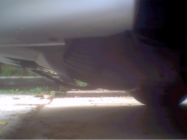 And here's a really bad picture of the 3" intake hosing that i took with my cheapo camera. If you can't see it i'm sorry, but If i can, I'll get my good camera and take another. But basically what I did, was, I hacked off my intake silencer with a steak knife, and extended the regular hose down farther and scooped it forward a few degrees. My car not only performs a whole lot better now, but it sounds really cool when it hits about 5000RPM, it sounds like its supercharged.