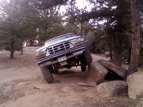1996 Ford Bronco - same rock as above pic. after i put in 2.5in progressive rate coils springs. removed front and rear sway bars.