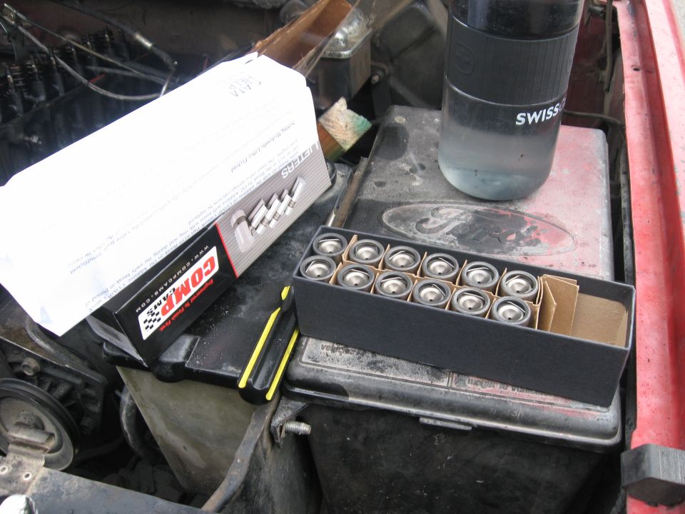 Open Comp Cams parts box on a Ford valve cover during an engine top-end job