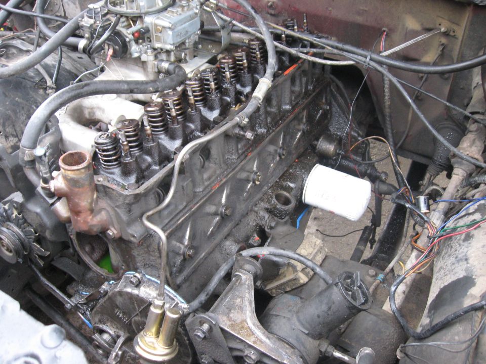 New lifters installed, a new lifter cover gasket, and the bolts back in place.