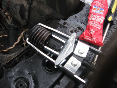 1981 Ford Bronco - Compressed spring. Don't let them fly off and hit you in the face. It hurts.