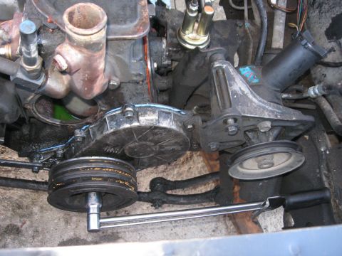 1981 Ford Bronco - Close-up of an engine's water pump, pulleys, and associated components.