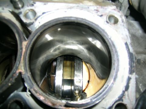 1995 Ford Probe - Close-up view of an engine cylinder, showing wear marks and internal components.