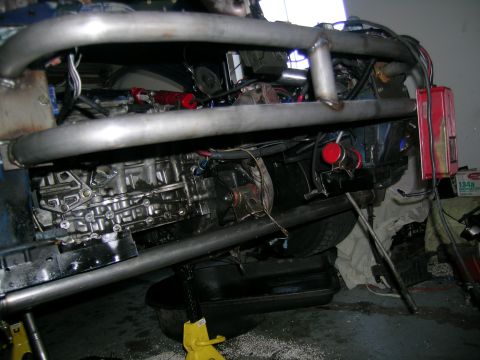 1995 Ford Probe - Custom engine bay modifications with prominent roll cage and turbocharger components visible.