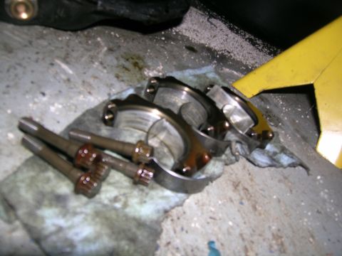 1995 Ford Probe - Engine connecting rods and main bearings are shown after removal from an engine.