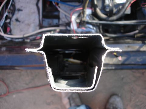 1989 Ford Taurus - Close-up view of a cut metal beam, likely from a vehicle's frame or body structure.