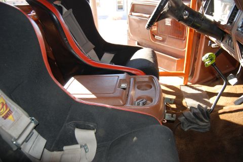 1982 Ford Bronco - Interior view of a 1982 Ford Bronco, racing seats and a custom shifter knob.