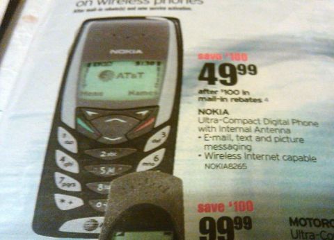 2000 Mercury Grand Marquis - This is a photo of a Nokia 8265 cell phone, advertised in a newspaper or magazine.