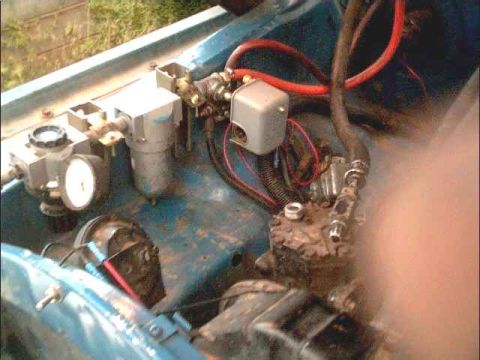 1978 Ford Bronco - Onboard air compressor system components are visible in this close-up view.