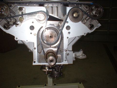 1965 Shelby Cobra - Close-up view of an engine's timing chain and gear system, showing the intricate mechanical components.