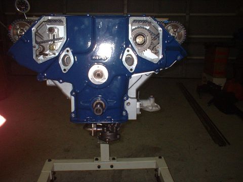 1965 Shelby Cobra - Engine block on a stand, showing internal timing chain mechanisms.