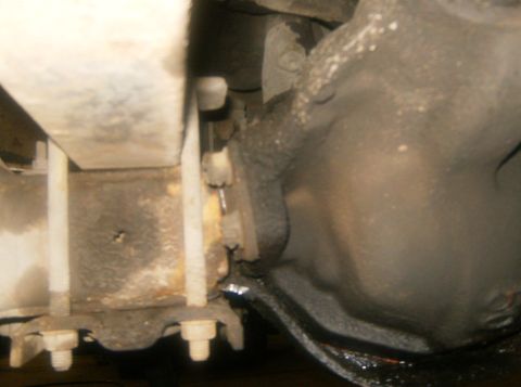 2000 Ford E350 - Undercarriage view showing suspension components and frame structure.