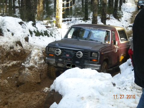 2005 Jeep Wrangler - A Ford Bronco tackles a challenging off-road course in a snowy, wooded area on November 27, 2010.