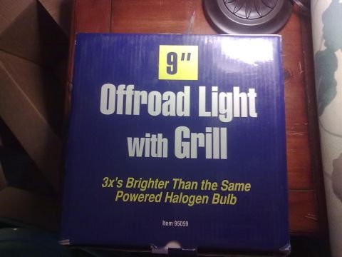 1978 Jeep CJ5 - The box for a 9-inch offroad light with grill is shown, highlighting its brightness compared to halogen bulbs.