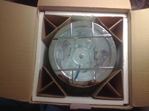1978 Jeep CJ5 - Headlight assembly packaged in a cardboard box with protective foam inserts.